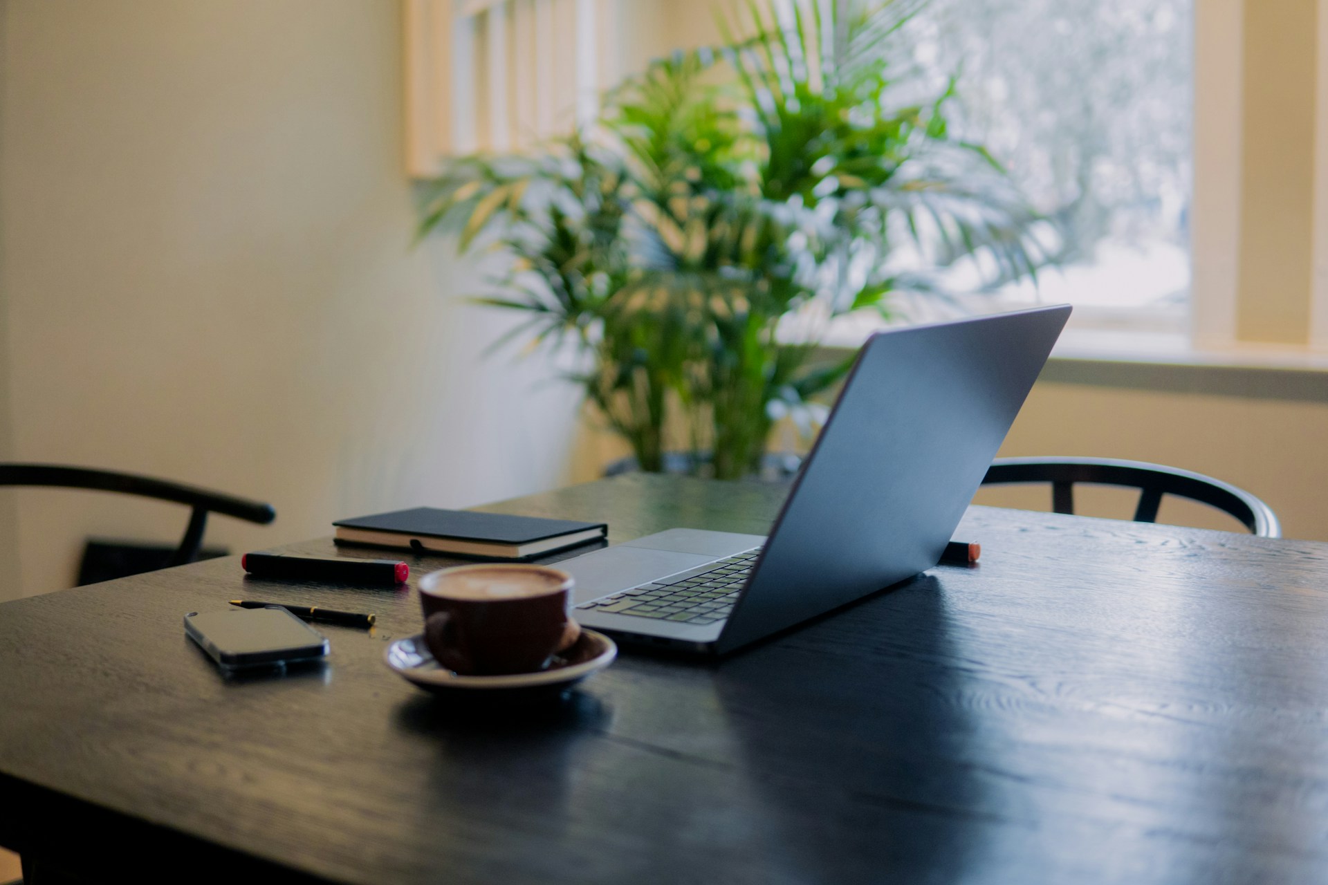Computer on a desk displaying an interior design website